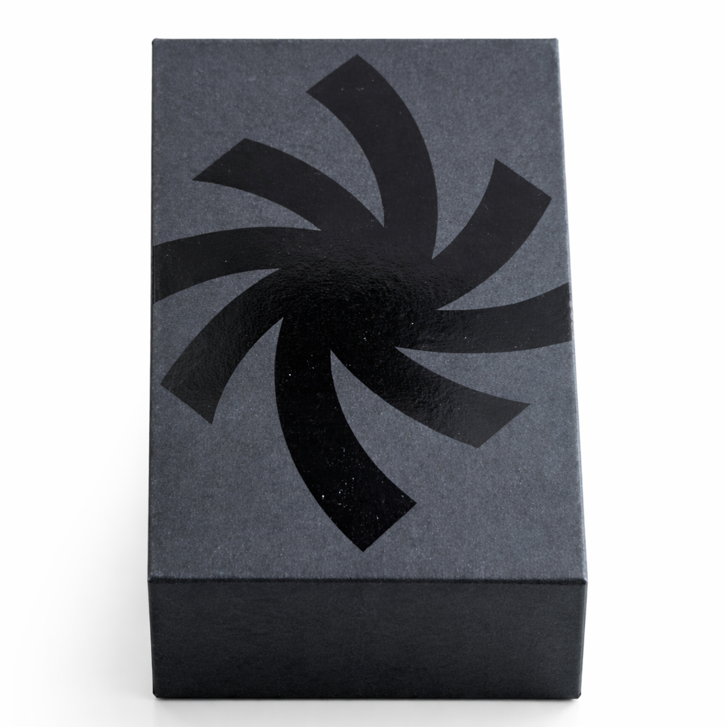 Nothin'else 50ml perfume Rectangular black box with a black varnished spiral design on a gray background