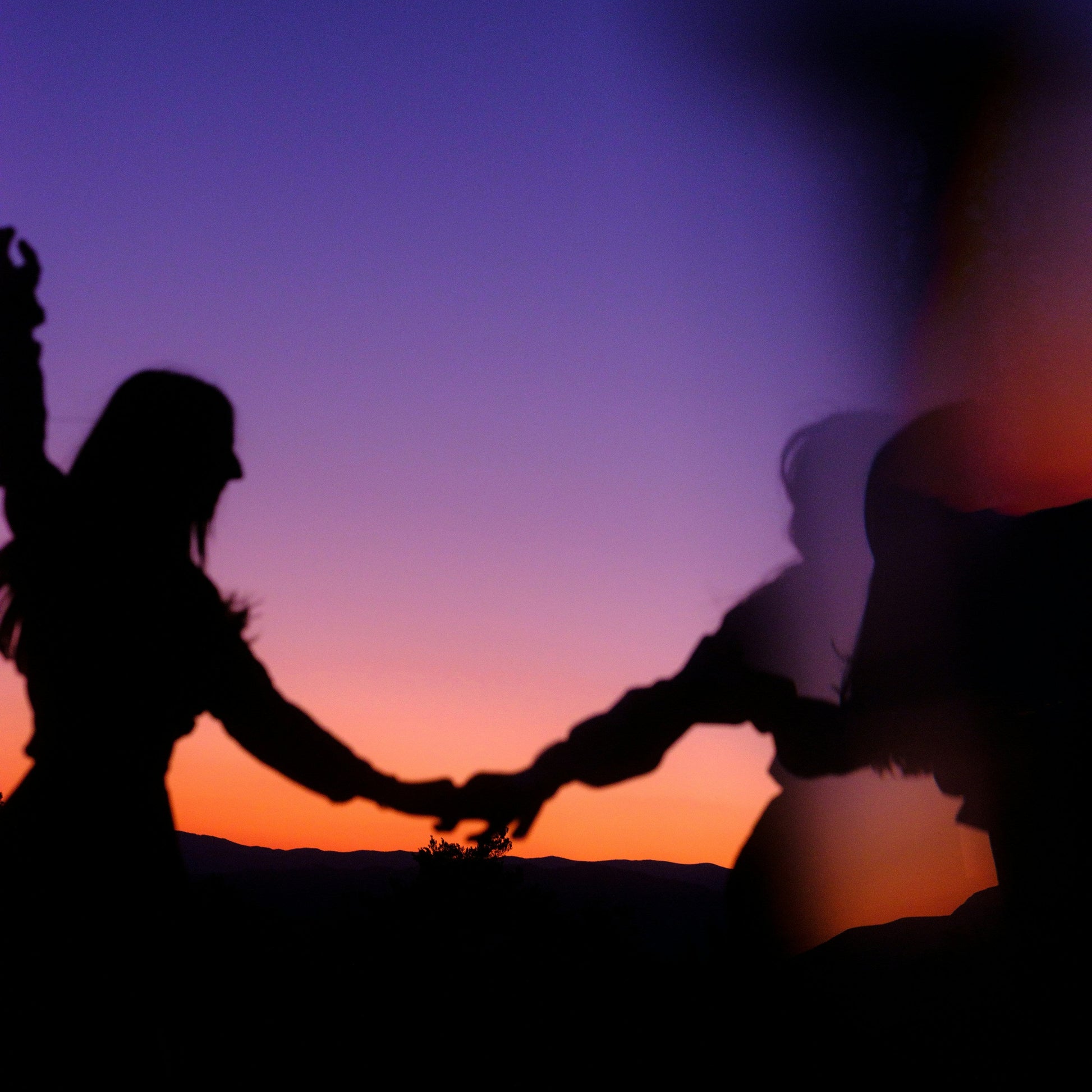 two people dancing their last dance at sunset