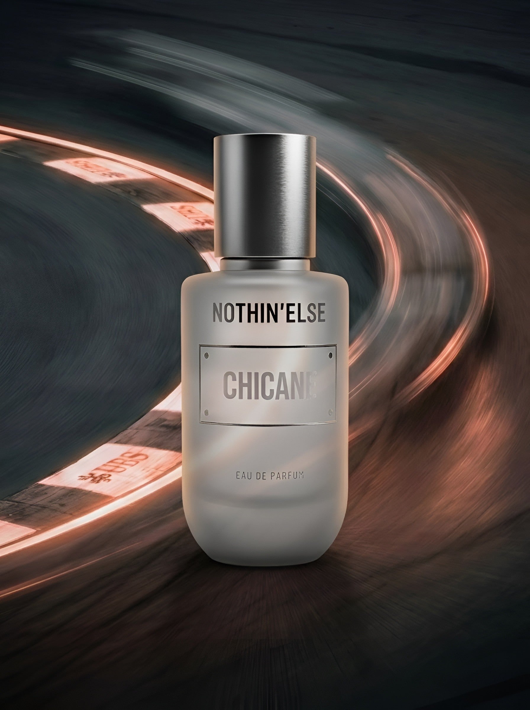Perfume bottle labeled 'Nothin' Else Chicane' with a blurred background