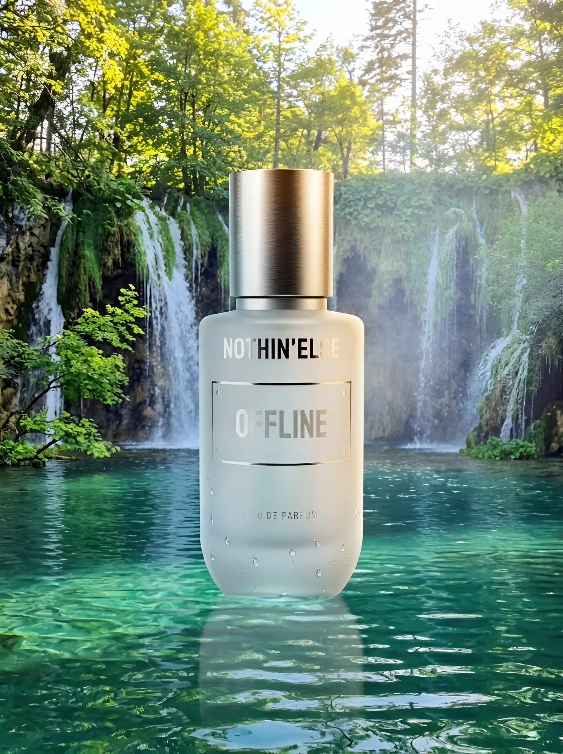 Bottle of 'OFFLINE' by NOTHIN'ELsE perfume in front of a scenic waterfall
