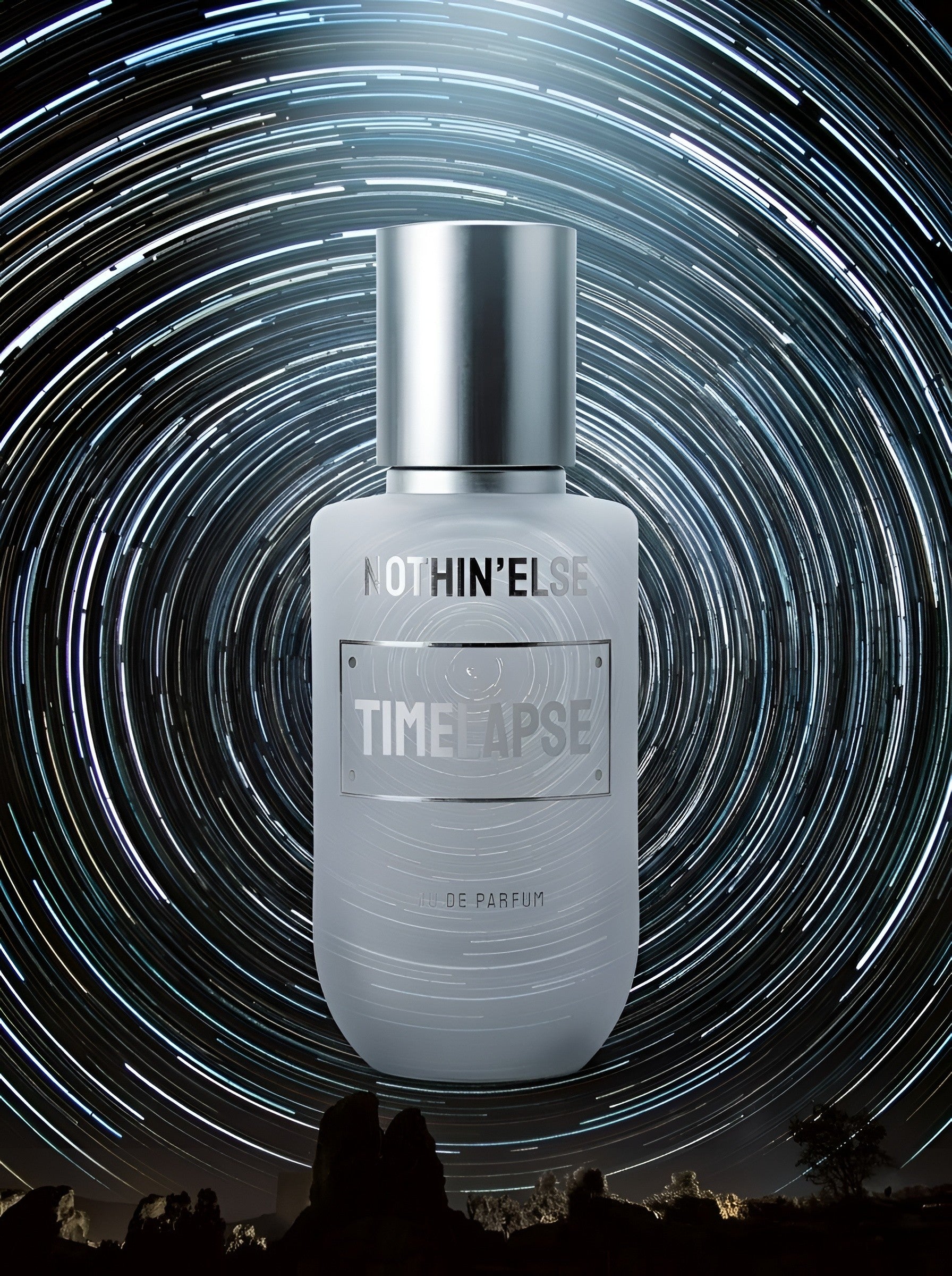Perfume bottle labeled 'Notihin'Else Time Lapse' against a starry night sky background